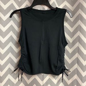Super cute Lululemon tank! Cropped and ties up the side are adjustable